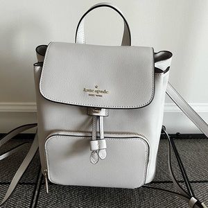 Pale amethyst Kate spade bag.